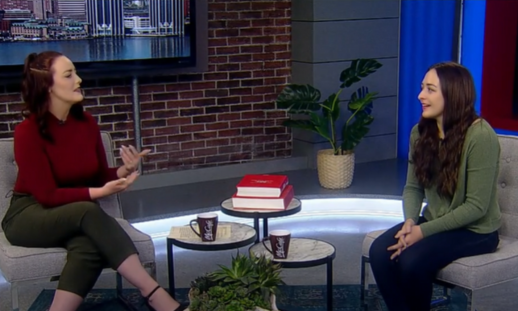 Global's Eilish Bonang (Left) sitting with Mikayla Marriott on the global news set - two chairs with three small coffee tables.