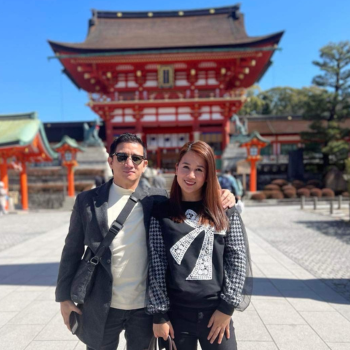 Joshua and Mary Grace in front of a traditional Asian building from their trip to South Korea and Japan.