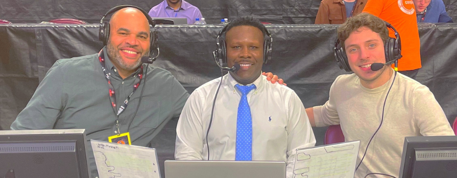 Vincent Williams with fellow sports broadcaster courtside of a game.