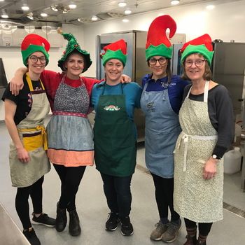 Philicity, Olivia, Nicole, Michelle, and Bern Byers at NSCC's Kingstec Campus making cheesecakes for cheesecake raffle winners.