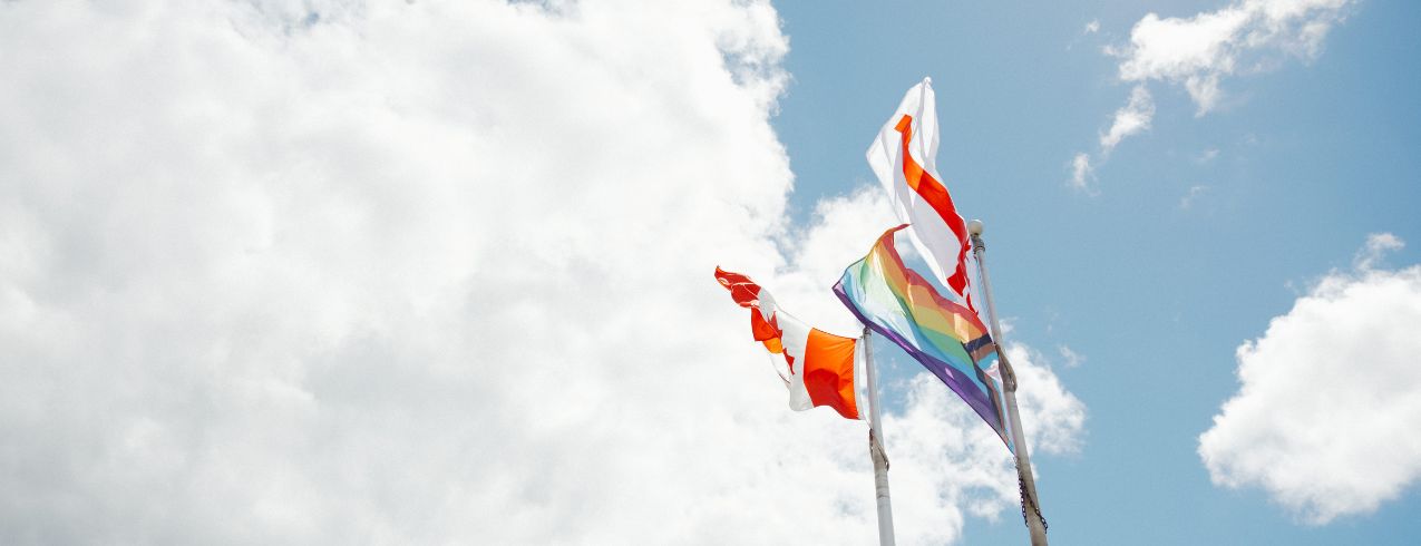 Flags raised outside NSCC IT Campus.