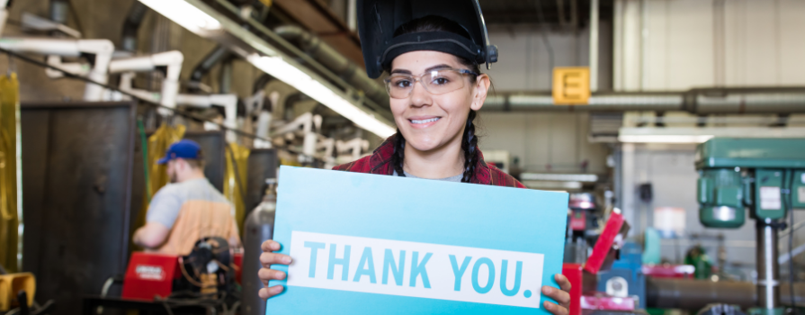 Photo of nscc student holding a sign saying thank you.