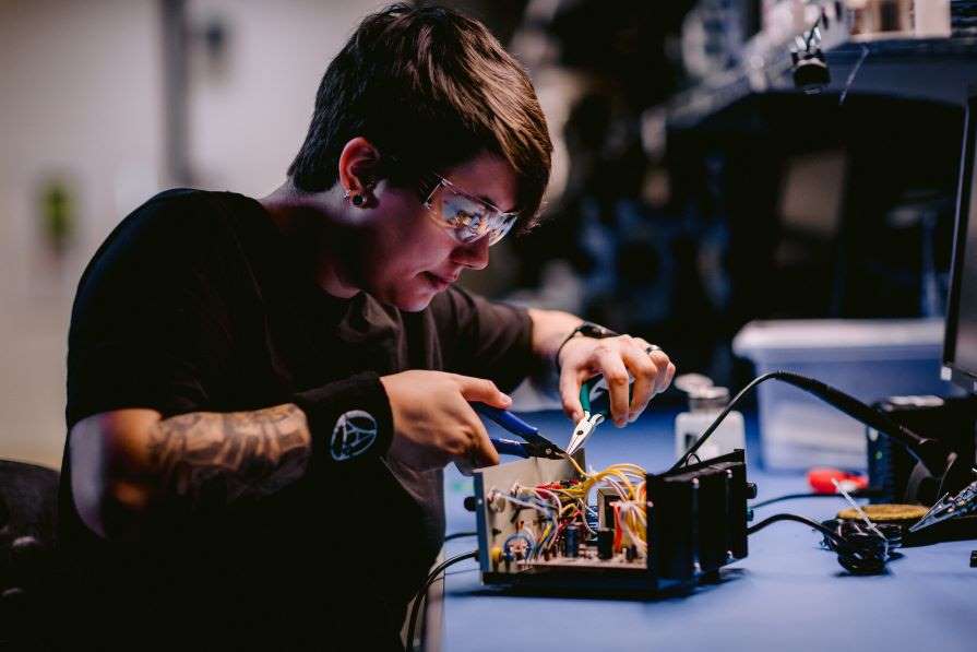 Student working on electronics