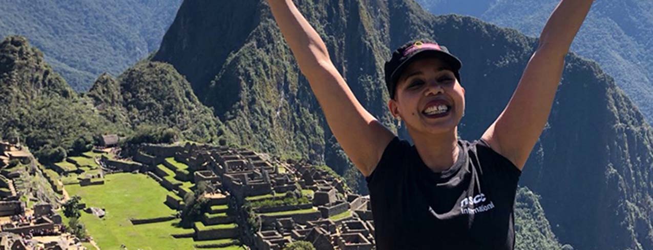 Meet Kate Sunabacka, enjoying the view from Machu Picchu while  participating in the Women in Entrepreneurship Project in Peru in 2019