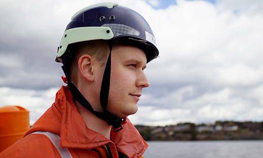 Instructor, Captain Arran Shepherd looking into the distance with the ocean in the background.