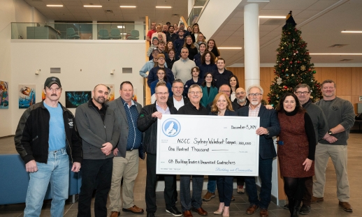 Photo of NSCC employees, skilled trades students, and representatives from Cape Breton Building Trades and Unionized Contractors with a cheque for $100,000 to Sydney Waterfront Campus