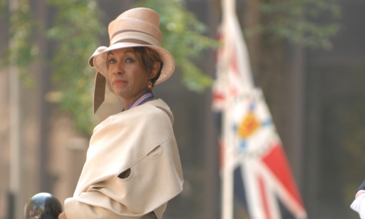 Photo of The Honourable Dr. Mayann E. Francis, in her suit that's displayed at Sydney Waterfront Campus's new interpretative display of Dr. Francis.