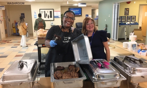 Left to right: NSCC employees Trena Hall and Katherine Osborne serving free meals with the Food for Thought program.