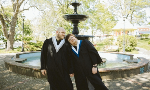 From left to right: Dustin and Zach in their convocations in front of the Frost Park Fountain in Yarmouth.