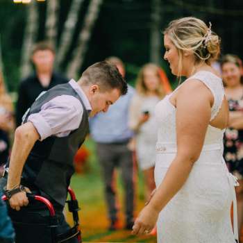 Chris Rice standing and dancing with his best friend on her wedding day.