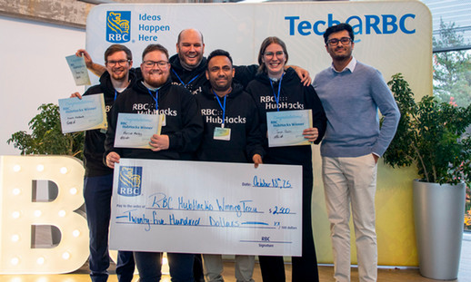 A group of NSCC students gather for a photo holding a large cheque for winning first place.