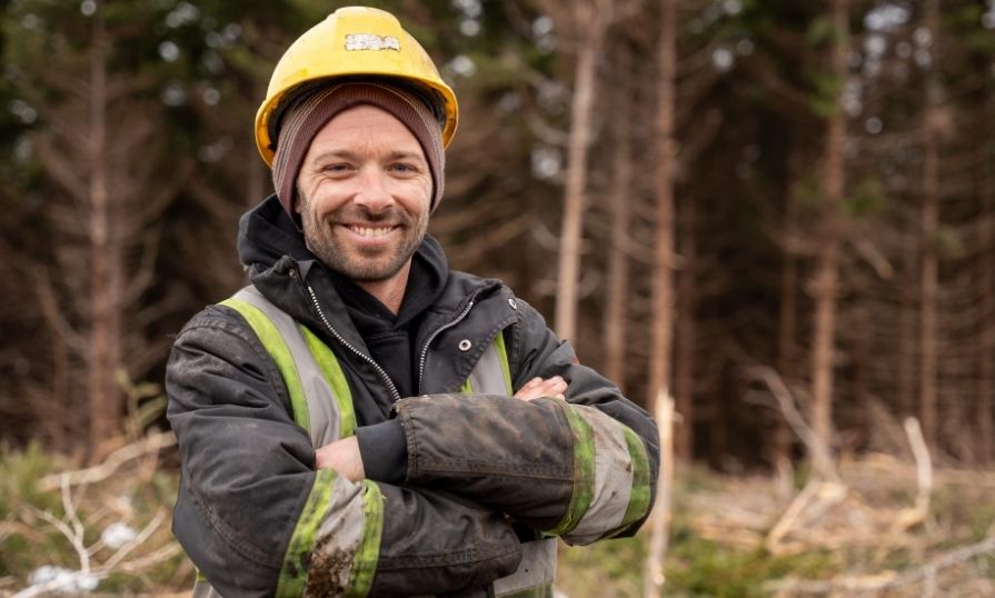 A forester wearing a PPE in the woods