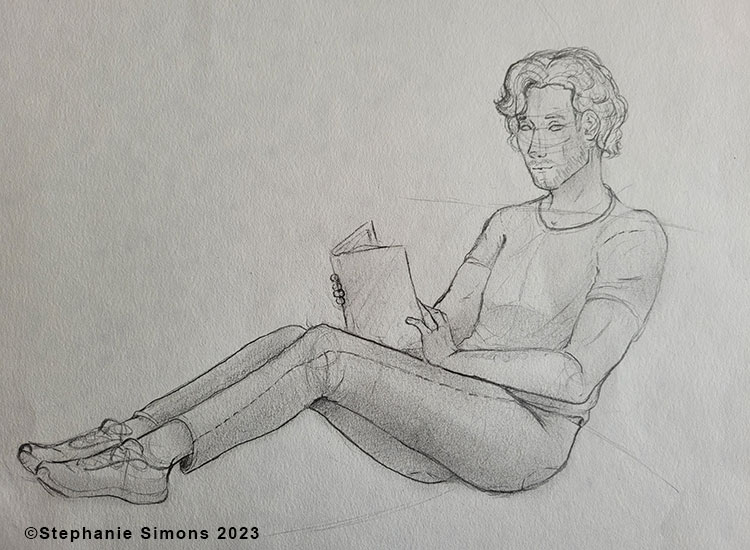 A life drawing of a person posed with a book.