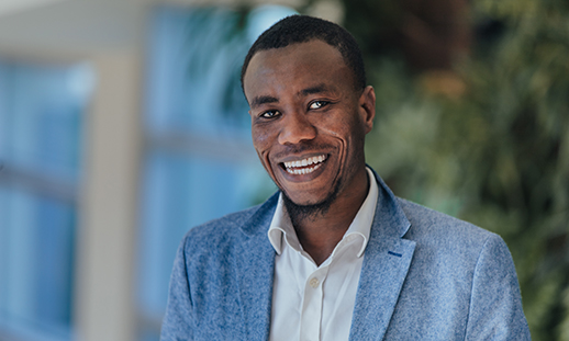 A portrait of a student smiling toward the camera at an NSCC campus.