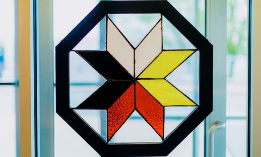A stained glass sculpture of the Mi'kmaq star.