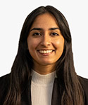 A headshot of Rachel, a young woman with long dark hair.