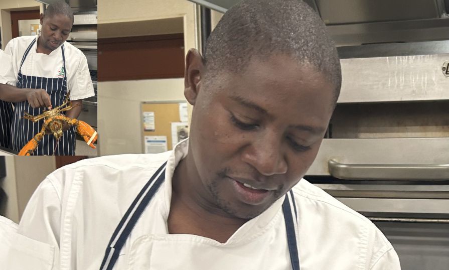 Chef Kalingu cooking and holding a lobster during a culinary session.
